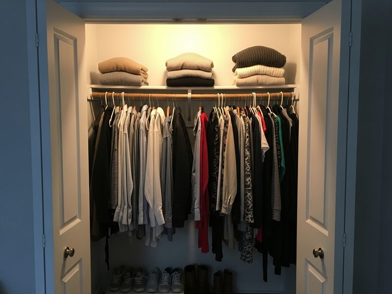 Small bedroom closet with hanging organizers