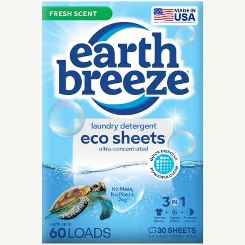 Earth Breeze laundry detergent sheets pack on a washer in a lived-in laundry corner